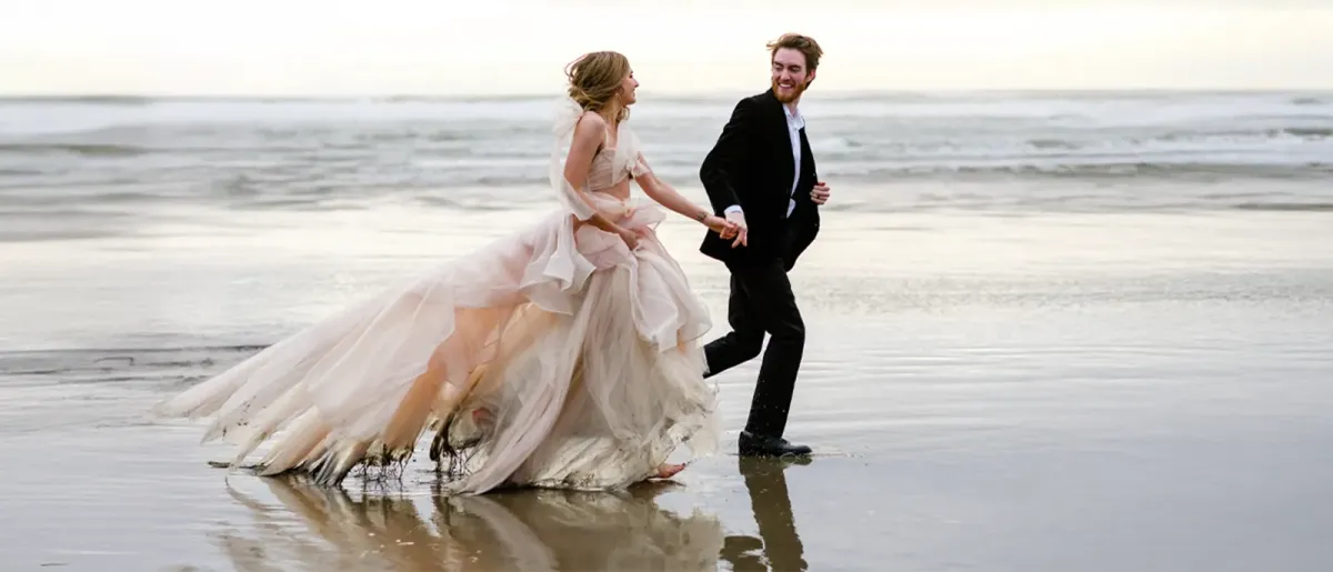 Couple on a beach during their wedding.