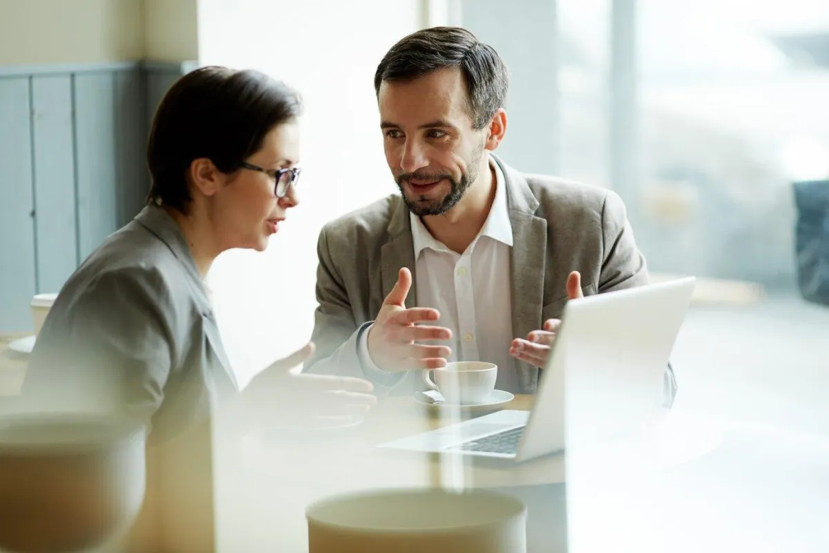 man and woman chatting - mentorship