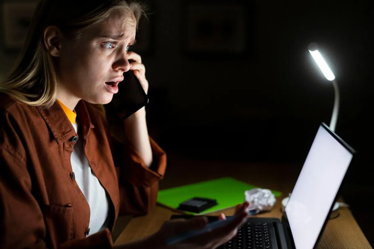 Worried woman on the phone - Cancel Culture