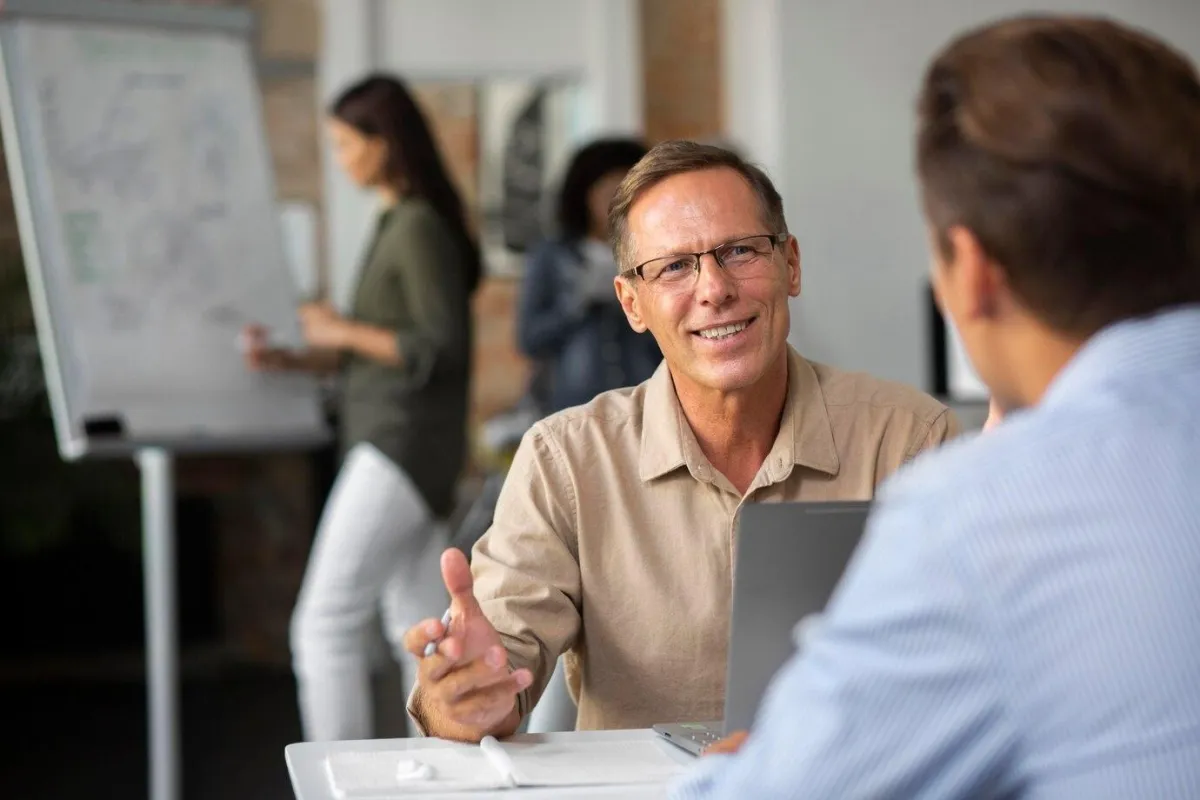 Man chatting with a co-worker - DIY Leadership Development