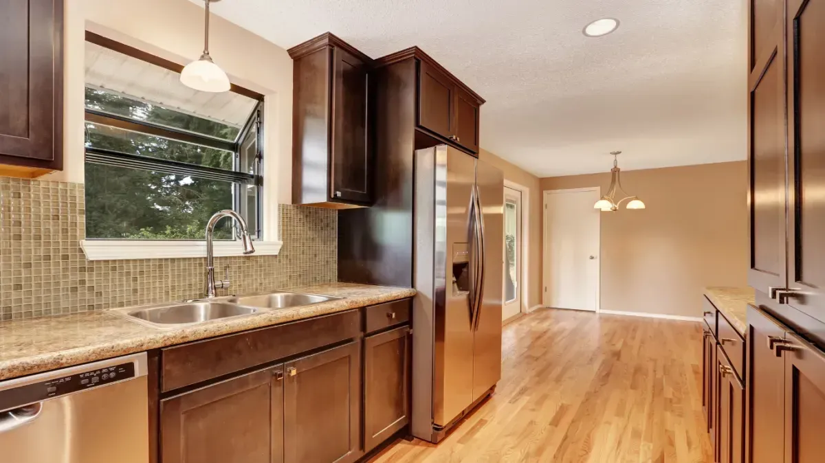 Open-concept kitchen remodel in Cornelius featuring a redesigned layout and new lighting