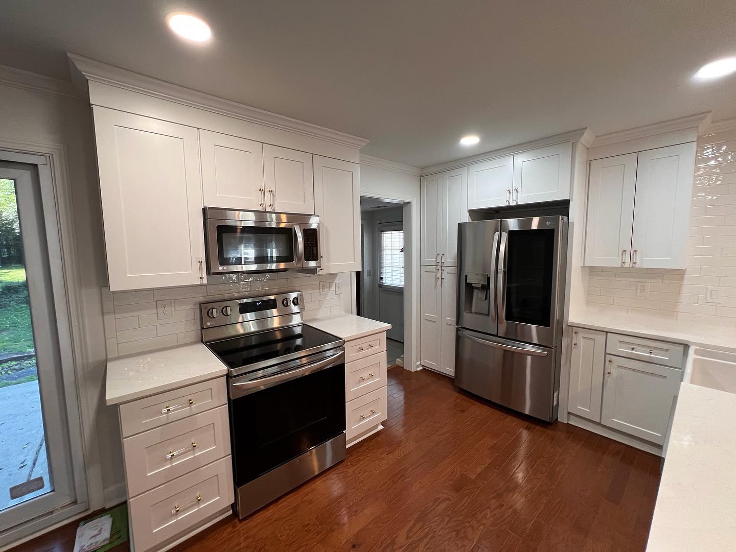 Transitional kitchen remodeling in Huntersville featuring a large island and pendant lighting