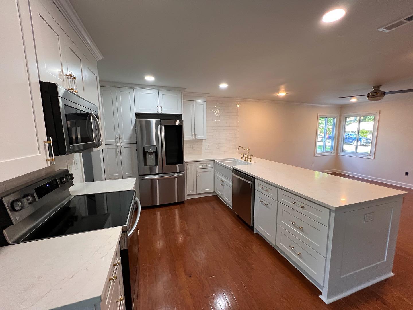 Modern kitchen remodel in Charlotte featuring white cabinetry and quartz countertops