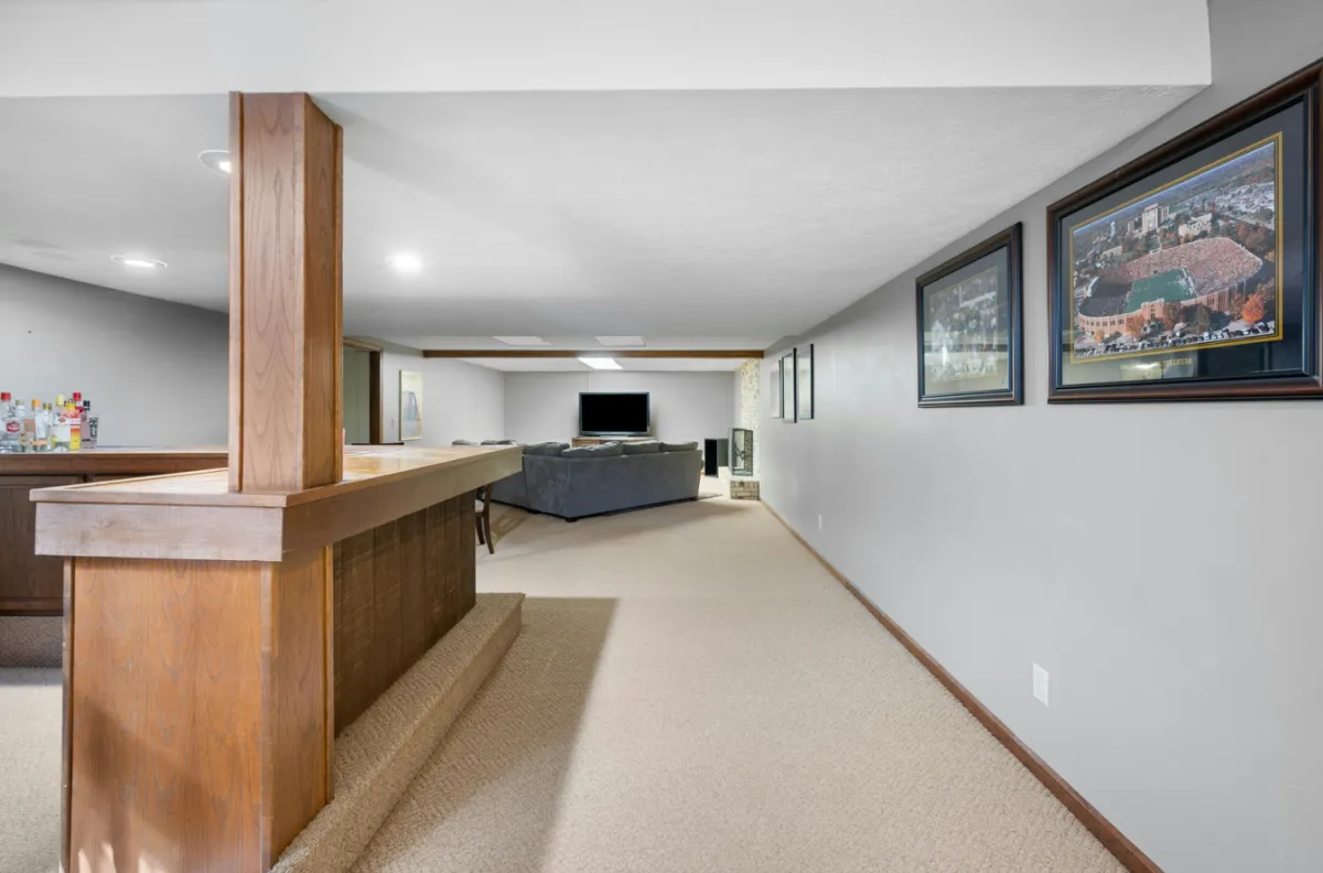 Finished basement in Charlotte featuring a bright living area and recessed lighting