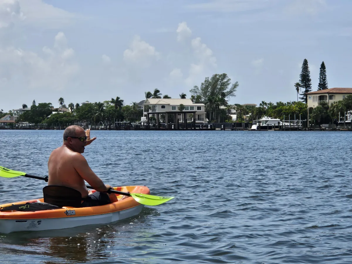 Man in his kayak over water