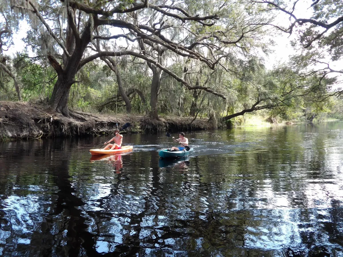 Two boys kayaking in East Lake Toho
