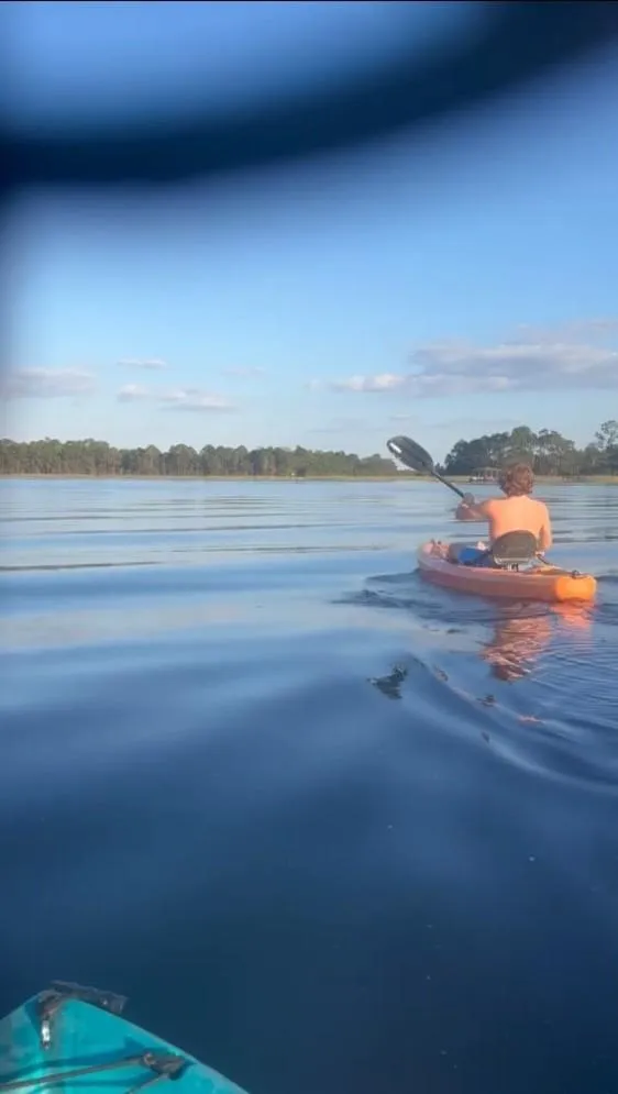 Person Kayaking in Kissimmee Lakefront lake
