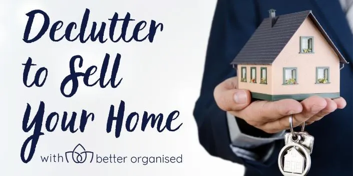 Text that reads "Declutter to sell your home" with a man's hand holding a miniature house and keys.