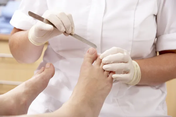 chiropodist treating feet