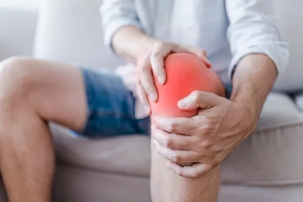man with knee cap