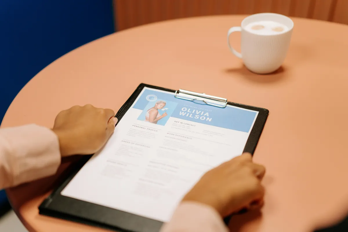 Hands holding a resume