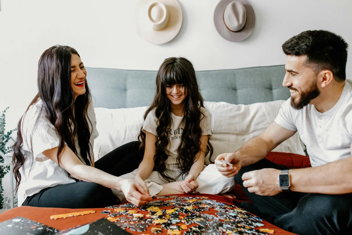 Family building a puzzle