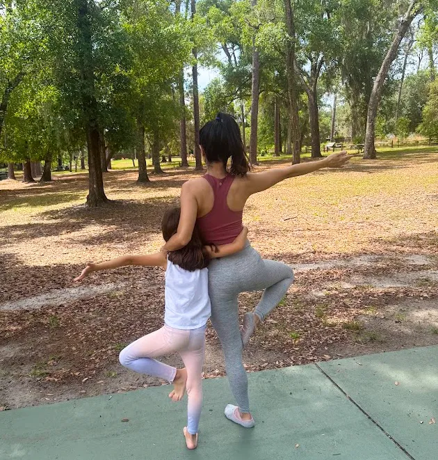 Mom and daughter hugging in nature