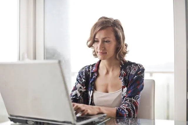 A woman working on her laptop