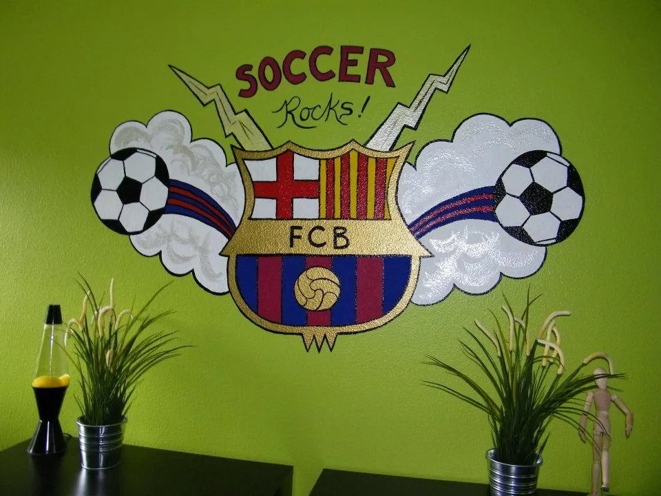 FC Barcelona logo with soccer balls and lighting bolts and the words "Soccer Rocks"