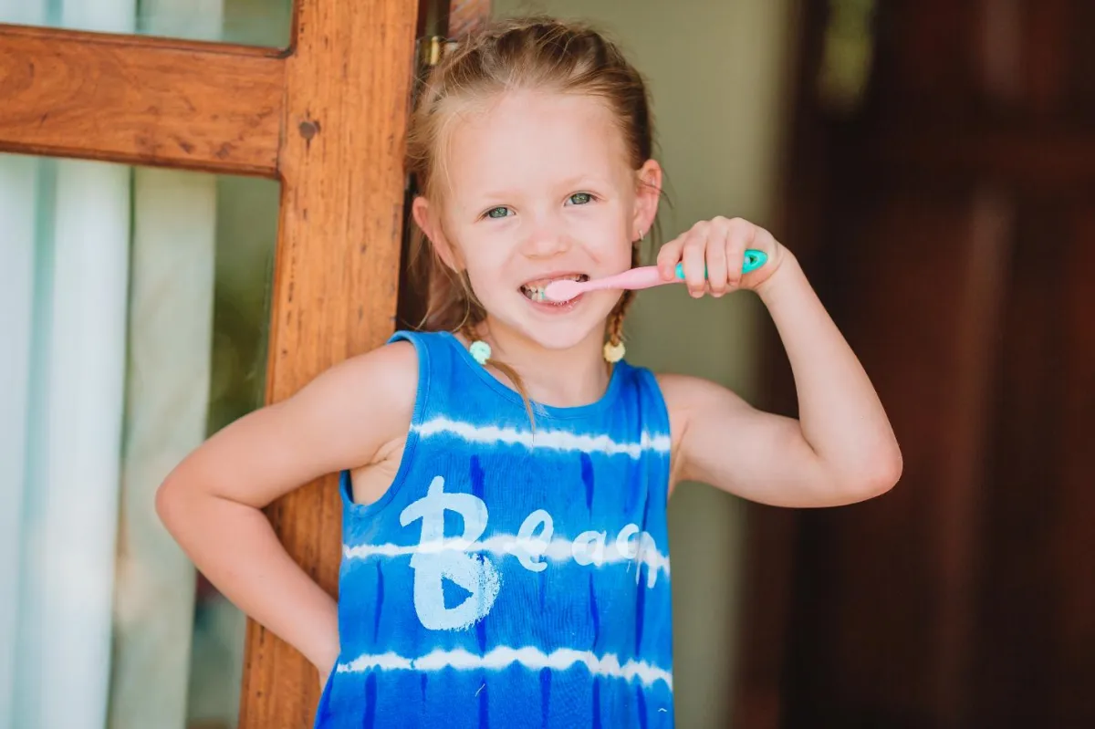 A child brushing her teeth.