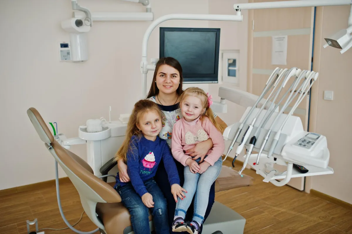 A mom with kids on a Dental Clinic