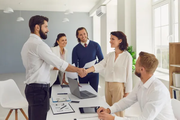 People shaking hands as a thank you