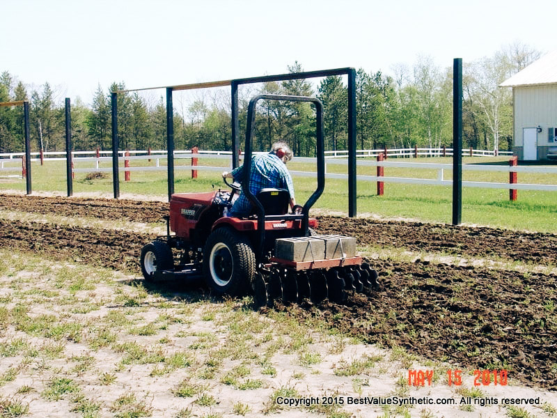 Carol Using the Tractor To Till 