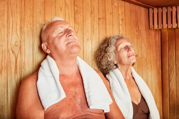 Woman in sauna relaxing to support natural detoxification of heavy metals