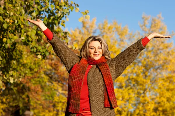 Midlife woman embracing a positive, hopeful approach to brain health and mental clarity