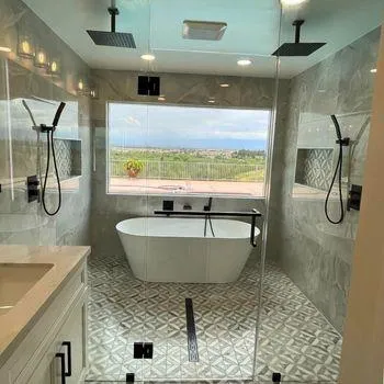 Large bathroom window replacement with modern shower and tub in Redlands, California