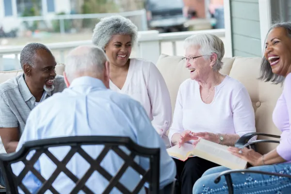 Image of seniors laughing and enjoying each other's company.