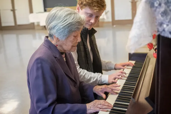 Image of seniors participating in music therapy, such as singing, playing instruments, or listening to music.