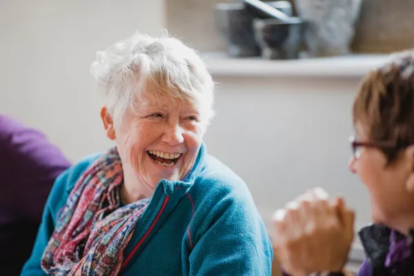 Image of seniors laughing and enjoying each other's company.