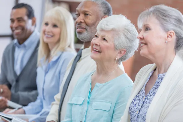 Image of seniors engaging in activities that spark curiosity and learning, such as visiting a museum, attending a lecture, or exploring a new hobby.