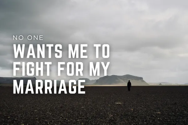 A solitary person walks across a vast, dark, rocky landscape under a cloudy sky, symbolizing loneliness and perseverance. Large text on the image reads: “No one wants me to fight for my marriage,” representing the emotional struggle of standing alone for a relationship when others say to give up.