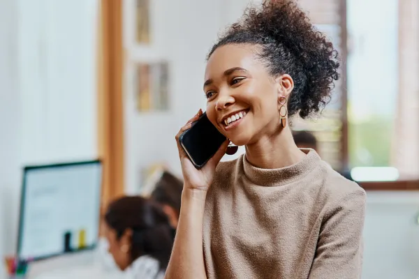 Business owner planning outreach marketing through email and direct mail to reconnect with clients