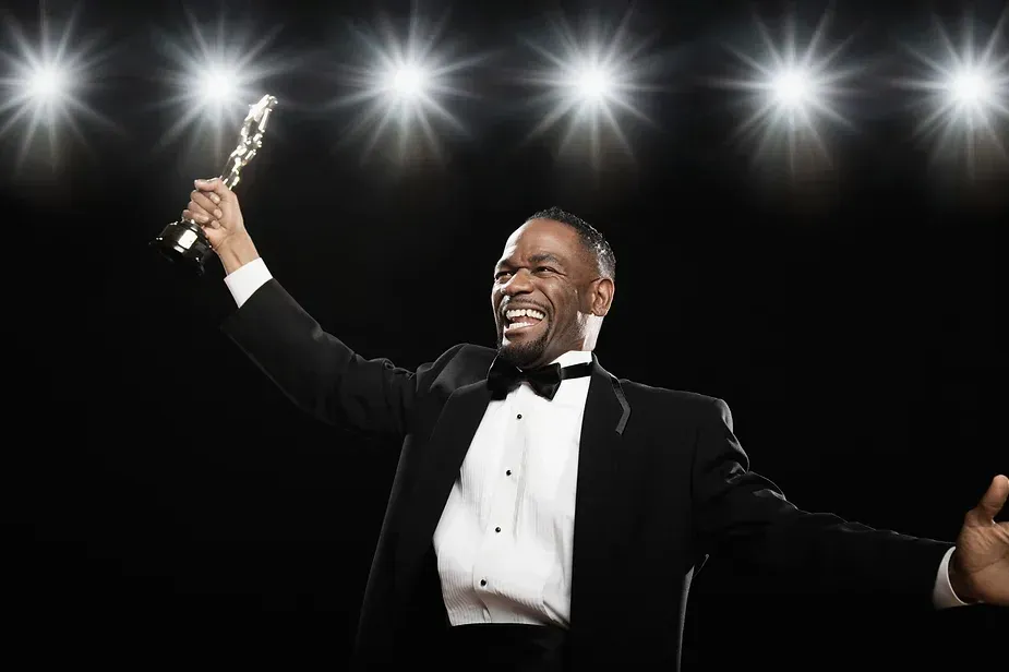 A Man with Trophy