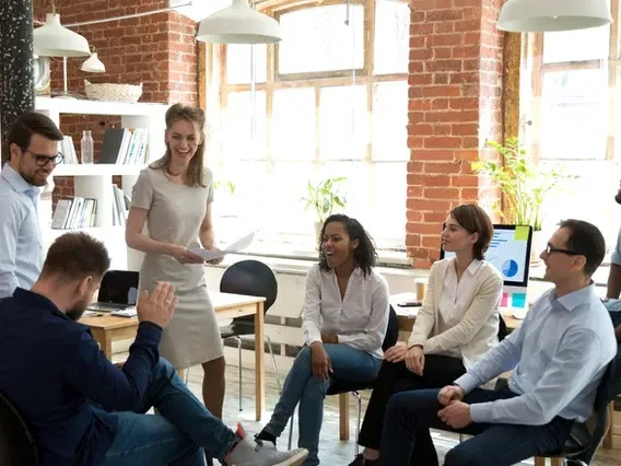 Many people having a conversation