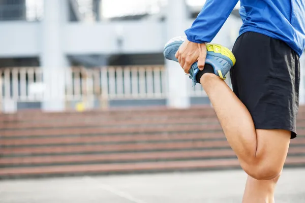 man stretching his hamstrings blog post cover