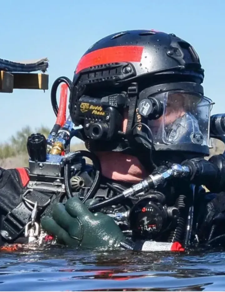 Volunteers demonstrating proper use of safety and rescue diving equipment