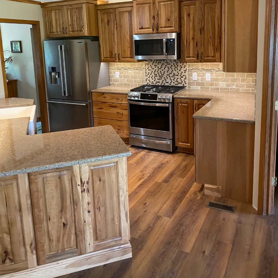 Kitchen remodel with wood cabinets in and custom backsplash in Wichita, Kansas