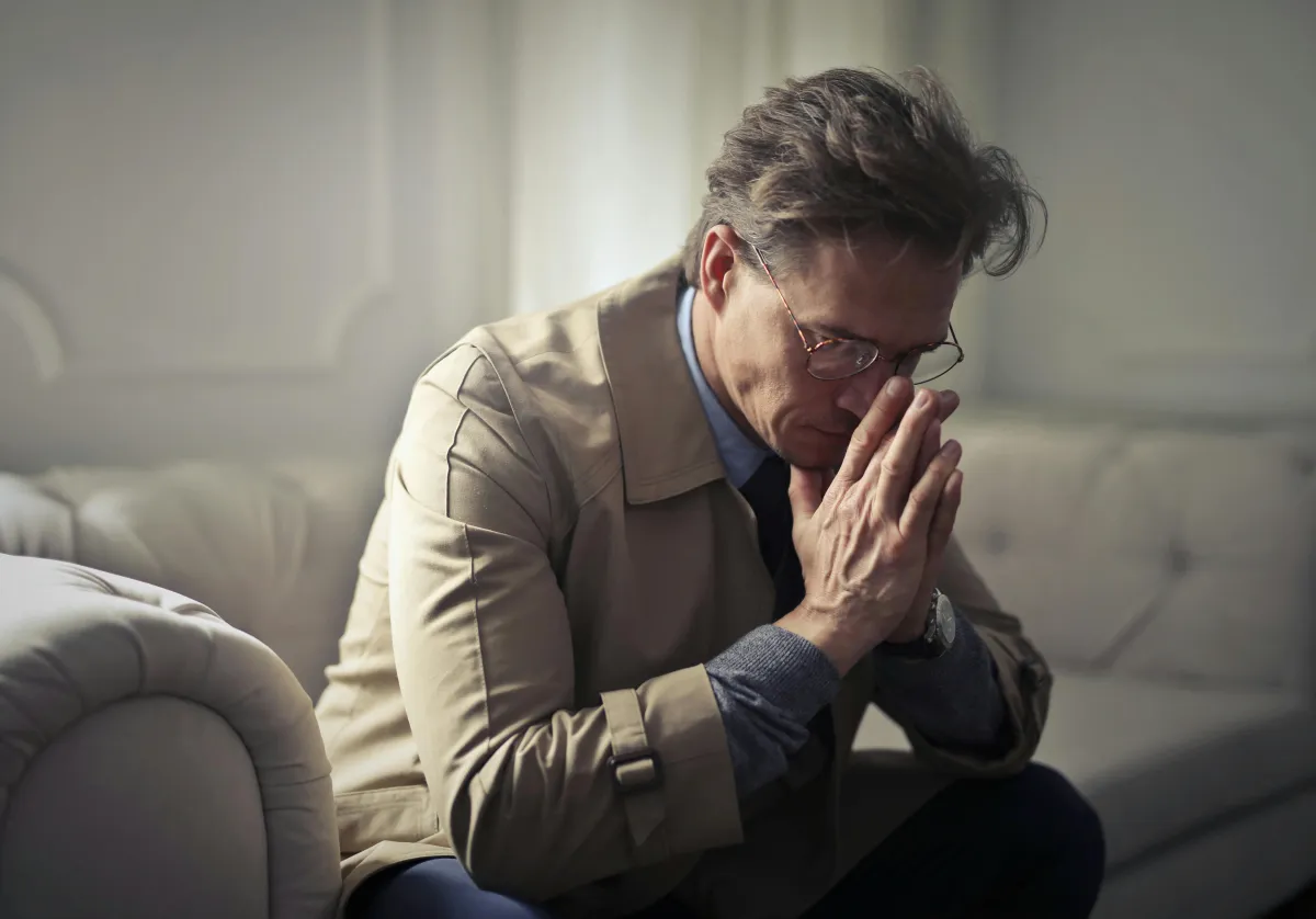 Man worried about IT compliance and risk mitigation without an AI powered contract analysis tool like ContracSage
