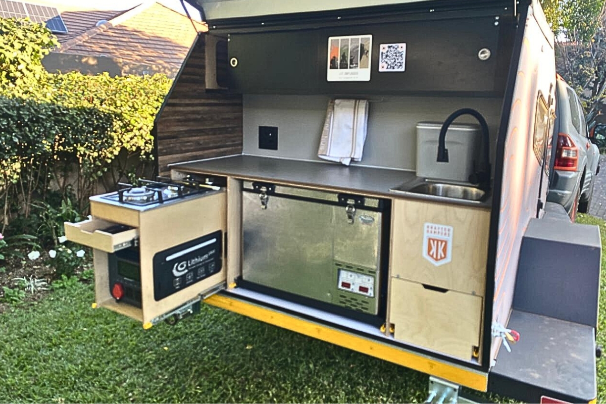 The fully equipped kitchen for our Geewhizz Kamper inlcuding Fridge, Power Station, Basin, etc.