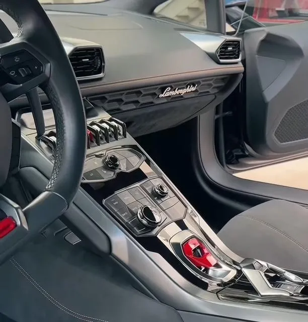 Luxury car interior being detailed in Houston with modern dashboard