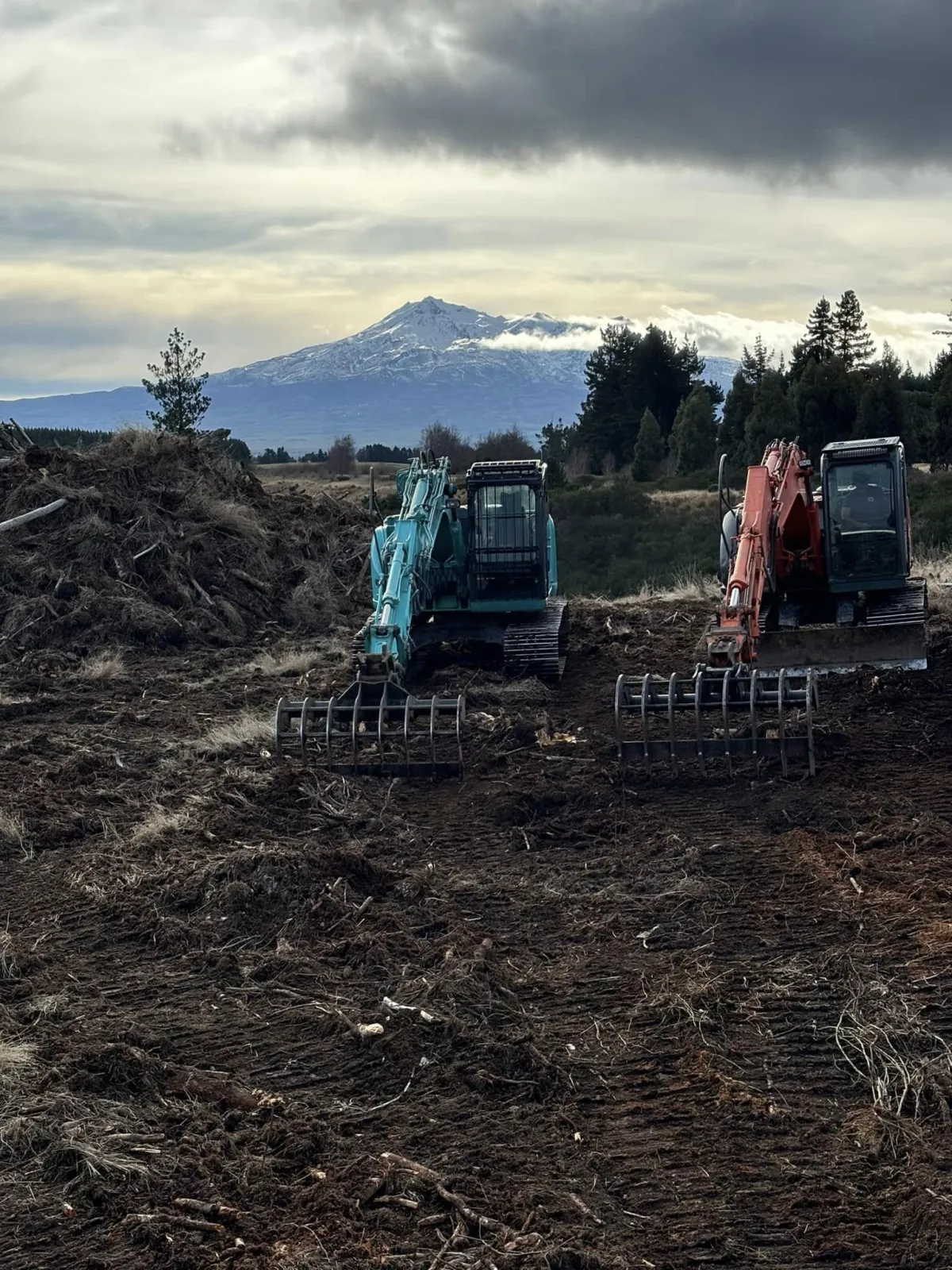 Excavator digging a trench for the installation of pipes and underground services.