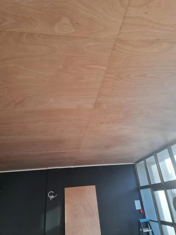 Ceiling interior lined with plywood sheets during plastering and gib preparation phase
