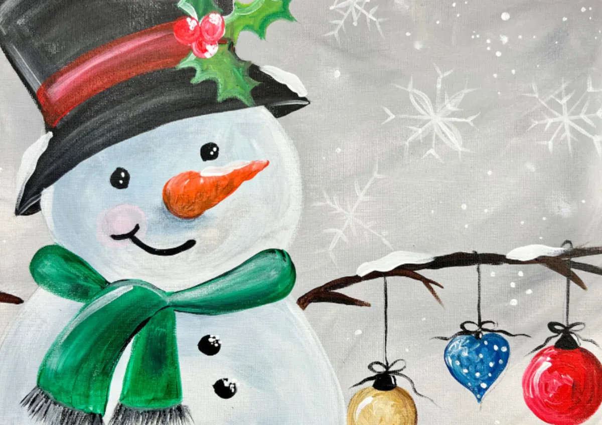 Smiling snowman painting with green scarf, holly hat and hanging Christmas baubles – Hull Christmas paint party design