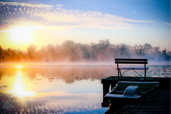 Peaceful morning mist over a quiet mountain lake in Washington State, symbolizing the calm, fleeting presence of a mobile notary during life's meaningful moments