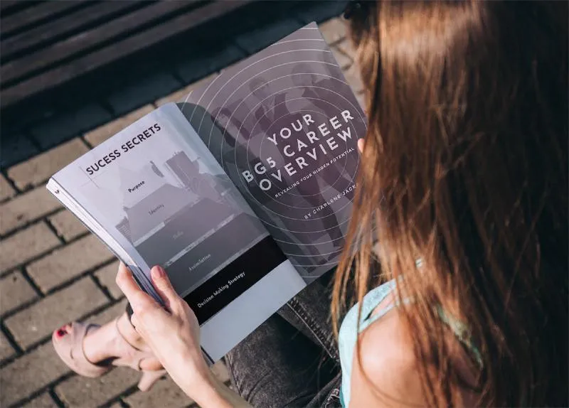 Woman Reading A Magazine About BG5 Career Design