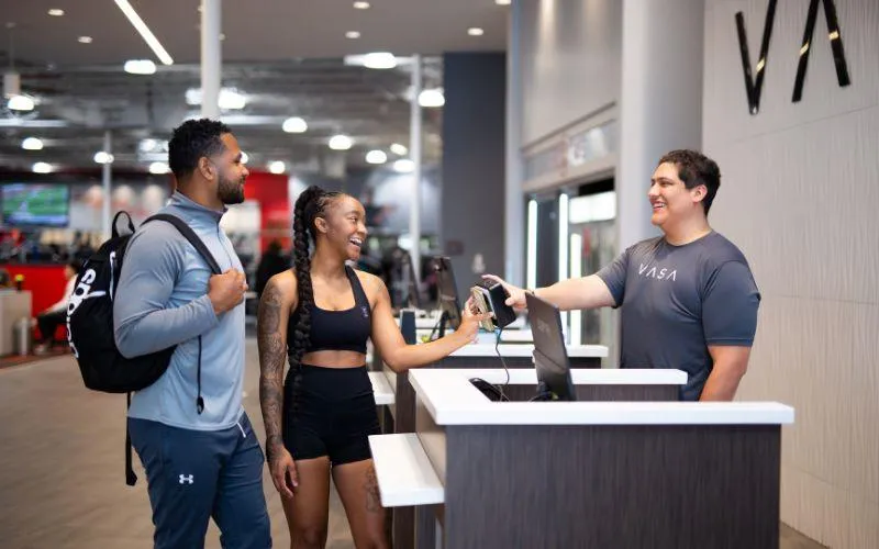 Couple checking into VASA Fitness