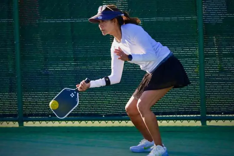 Women hitting a pickleball - St. George Health and Wellness Magazine