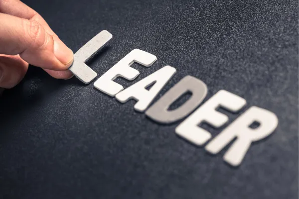 leader in black and white bold letters