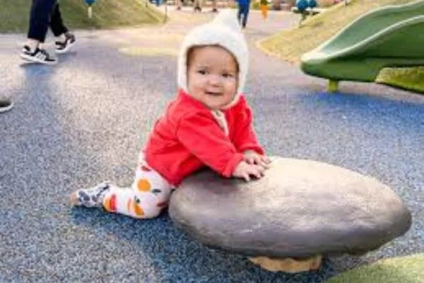 a baby on a stone