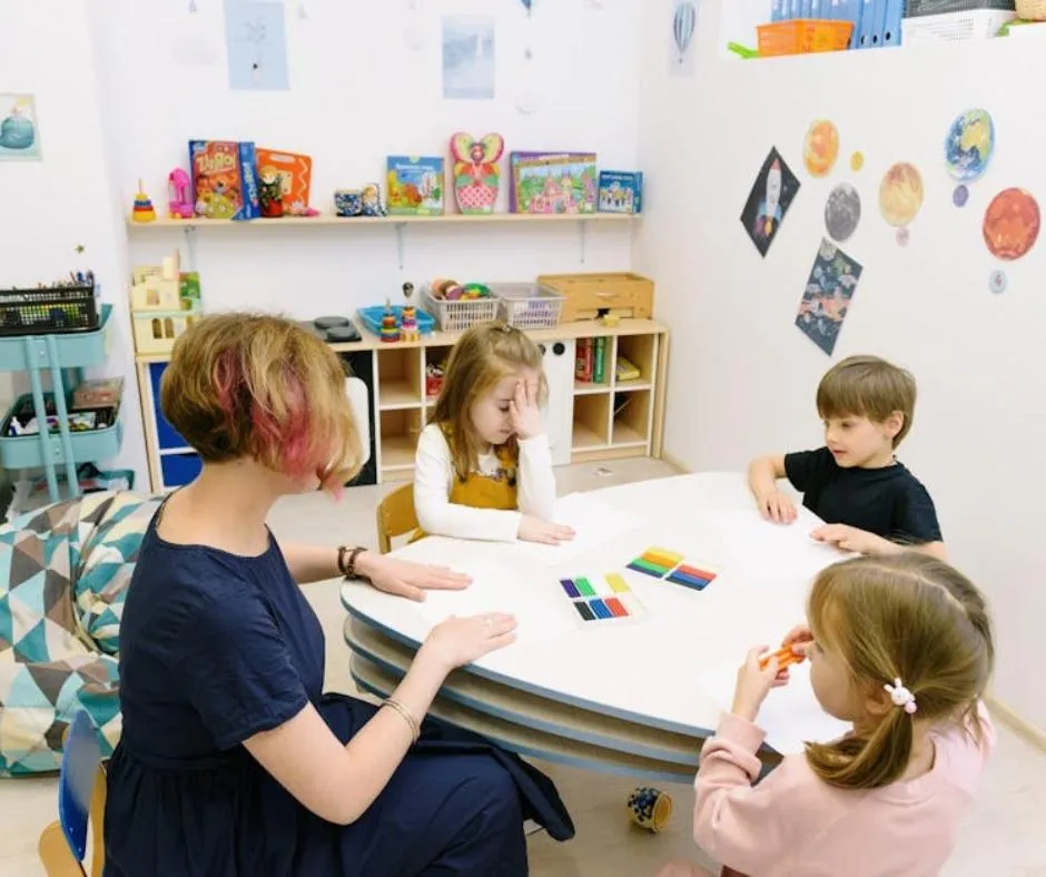 teacher with children in a classroom